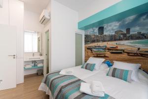 Posteľ alebo postele v izbe v ubytovaní Petit Accommodation Las Canteras Troisième