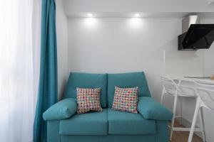 A seating area at Petit Accommodation Las Canteras Troisième