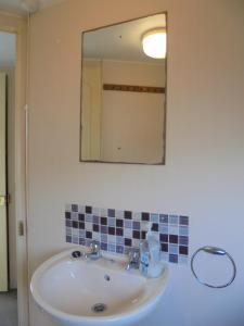 a bathroom with a sink and a mirror at 8 Berth on Coastfields (Everglade) in Ingoldmells +25 photos