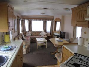 a kitchen and living room of an rv at 8 Berth on Coastfields (Everglade) in Ingoldmells