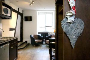 TV a/nebo společenská místnost v ubytování Guesthouse Le Vauban
