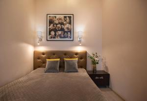 a bedroom with a large bed with two pillows at Apartment & Parking "Opera at the corner" in Odesa