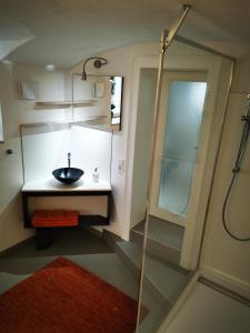 a bathroom with a sink and a shower at Drachenhöhle in Oldenburg
