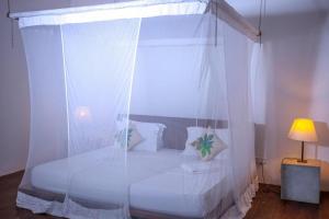 Postel nebo postele na pokoji v ubytování Knight Inn - Galle Fort