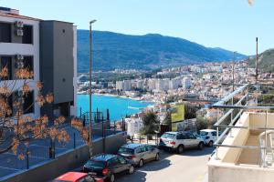 a view of a city with cars parked on a street at Lemon Hill in Herceg-Novi