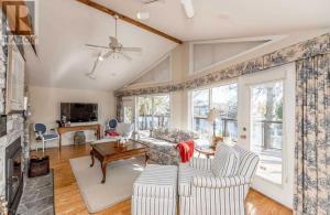 a living room with two chairs and a couch at Waterfront Cottage 4 BD with Outdoor Dining, Fire Pite by GLOBALSTAY in Brechin