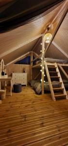 a bedroom with a bunk bed in a tent at BB camping in Liepāja