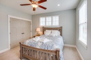 a bedroom with a bed and a ceiling fan at 410A The Jetty House in Virginia Beach