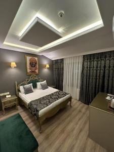 Кровать или кровати в номере Ethnica Hotel Old City