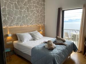 Postel nebo postele na pokoji v ubytování Vladimiros Apartments