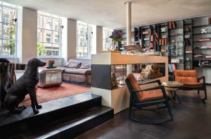 a living room with a dog statue in the middle at Sir Albert Hotel, part of Sircle Collection in Amsterdam