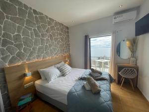 Postel nebo postele na pokoji v ubytování Vladimiros Apartments