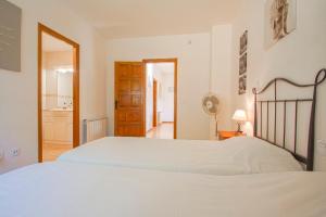 A bed or beds in a room at Club Villamar - Stralitzia