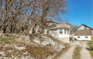 a house sitting on top of a hill at Nice Home In Lngekrr With Kitchen in Klövedal