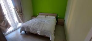 Posteľ alebo postele v izbe v ubytovaní Case vacanze LE ROSE