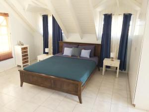 Säng eller sängar i ett rum på Palm Beach Cunucu villa