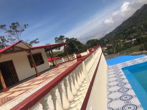 a view of a resort with a swimming pool at Finca Rosabel cerca a Villeta in Quebradanegra