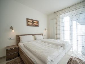 Postel nebo postele na pokoji v ubytování Seeresidenz Haus Baltic, App A02