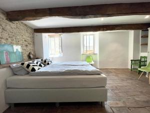 a bedroom with a bed in a room at Palazzo Minzoni in SantʼIppolito