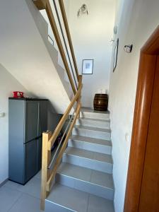 a staircase in a house with blue steps at Apartments Holiday Gavric in Trogir