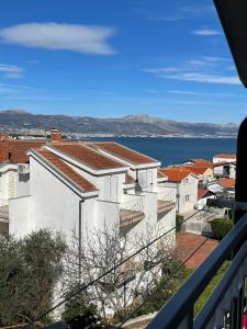 a view from the balcony of a white building at Apartments Holiday Gavric in Trogir