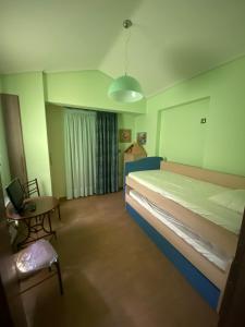 Postel nebo postele na pokoji v ubytování VILLA RIA