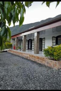 a large building with windows and a courtyard at Charmante maison au cœur des 3 montagnes in Salazie