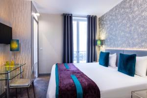 Postel nebo postele na pokoji v ubytování ATN Hôtel