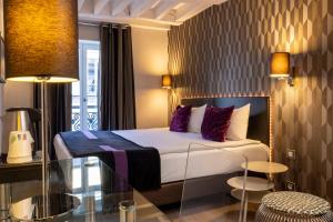 Postel nebo postele na pokoji v ubytování ATN Hôtel