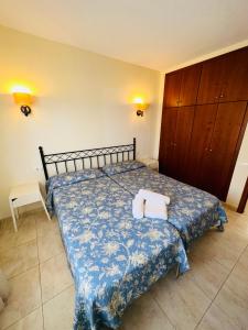 a bedroom with a bed with two towels on it at Pier View Los Cristianos Free WiFi in Los Cristianos