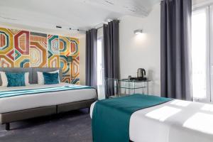 Postel nebo postele na pokoji v ubytování ATN Hôtel