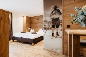 Postel nebo postele na pokoji v ubytování Embacher Sporthotel + 37 fotografií
