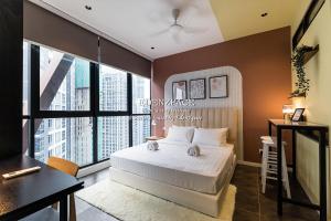 a bedroom with a bed and a large window at Scarletz Suites by Edenzpace @ KLCC Area in Kuala Lumpur