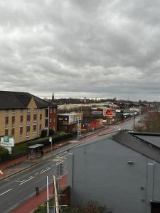a view of a city with a road and buildings at Lovely 1bed apartment, Salford. in Manchester