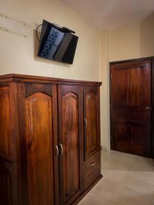 TV a/nebo společenská místnost v ubytování Hostal Wilson Inn