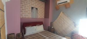 Postel nebo postele na pokoji v ubytování Riad Dar Lemdrssa