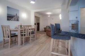 a kitchen and dining room with a table and chairs at Sea Breeze Apt 3 - 2 Bedroom - Horton Beach in Horton