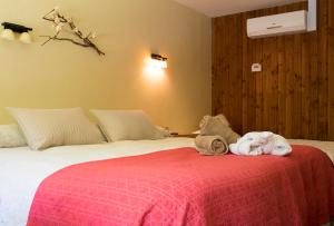 Postel nebo postele na pokoji v ubytování Hotel y Termas Huife