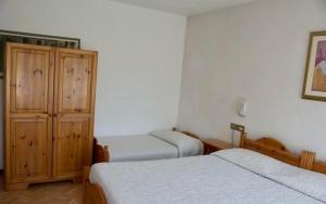 Voodi või voodid majutusasutuse Albergo Piani di Luzza toas