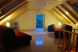 a living room with two couches and a window at Villa Rosa in Donji Morinj