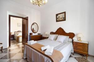 A bed or beds in a room at Casa Macarena