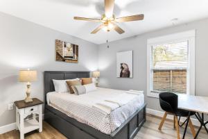 a bedroom with a bed and a ceiling fan at Brand New Bungalow with King Bed Suites in St Aug in St. Augustine