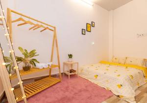 a bedroom with a bed and a swing at MTV Homestay Vũng Tàu in Vung Tau