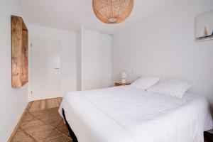 Łóżko lub łóżka w pokoju w obiekcie Très belle appartement haut standing