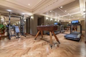 a gym with a sink and exercise equipment at Hotel Locarno in Rome