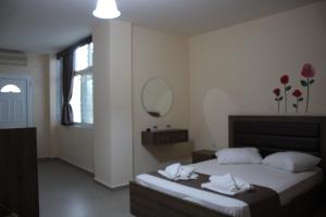 Posteľ alebo postele v izbe v ubytovaní House Stamatis