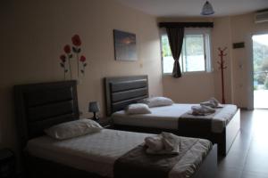 Posteľ alebo postele v izbe v ubytovaní House Stamatis