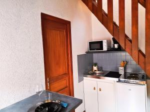 Kuchyň nebo kuchyňský kout v ubytování L'Authentique - Appartement Cosy En Hyper Centre