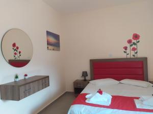 Posteľ alebo postele v izbe v ubytovaní House Stamatis