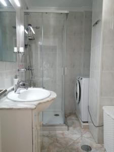 a bathroom with a sink and a shower and a toilet at Apartment El Dorado, Las Americas in Arona